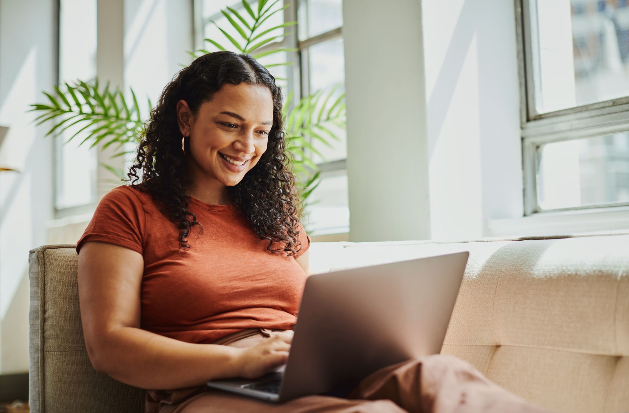 Woman using a laptop.